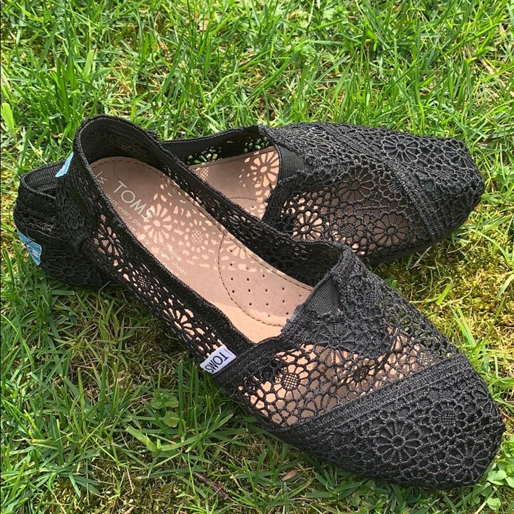Black lace slip on TOMS shoes